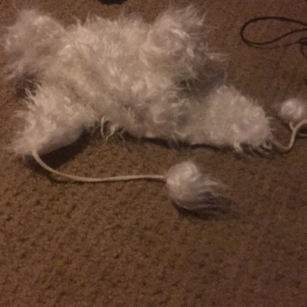 Fluffy white hat with strings